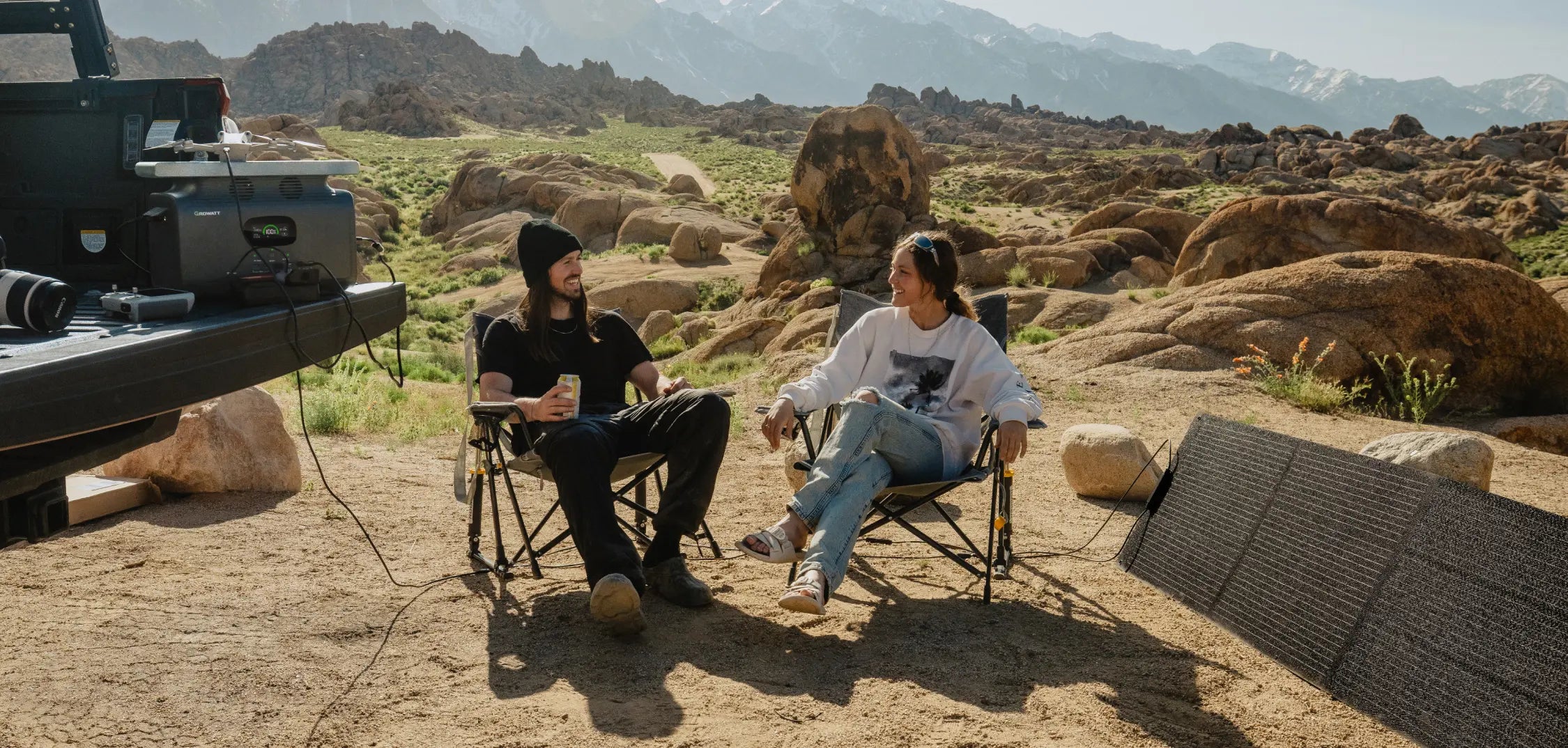 2 men car camping with portable solar panel