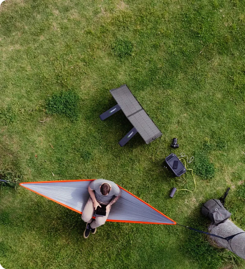 a man camping with Growatt solar generator